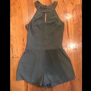 Olive green romper with gold neck trim! Size Small